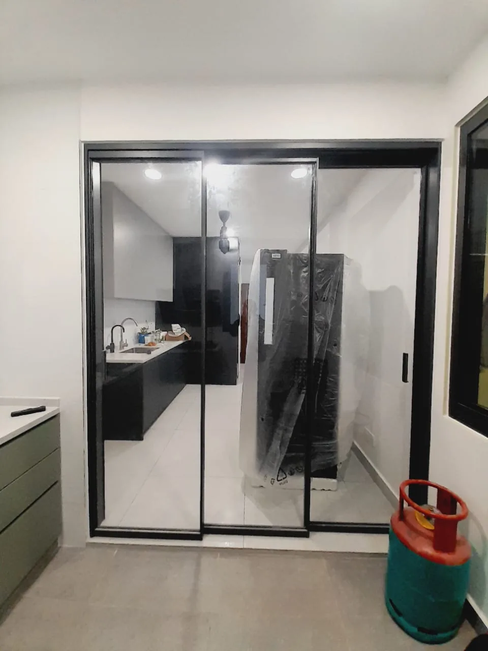 Process — Black frame kitchen sliding glass door